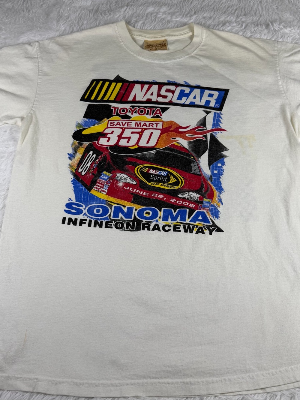 The Mountain White NASCAR Sonoma Infineon Raceway Tee with Red and Blue Graphics